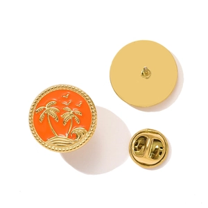 Detail of a gold-plated coconut tree enamel pin with wave motifs and butterfly clutch
