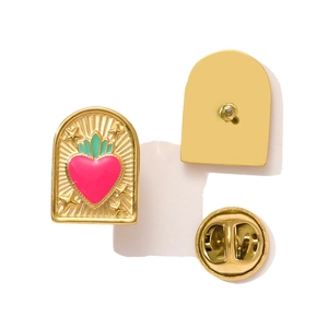Detail of arch-shaped enamel brooch with pink heart and golden star radiant patterns