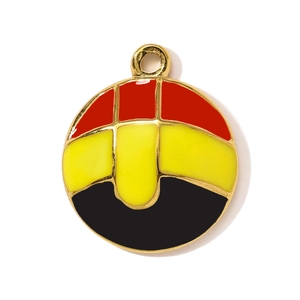 Detail of round stainless steel pendant with red yellow and black enamel finish