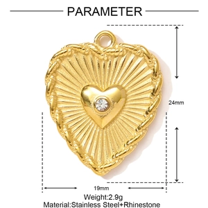 Detail showing a golden heart pendant with sunburst texture and sparkling rhinestones