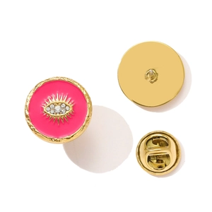 Detailed front and back views of an evil eye brooch with pink enamel and crystals