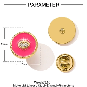 Detail view of pink enamel sun brooch with rhinestones and stainless steel back pins