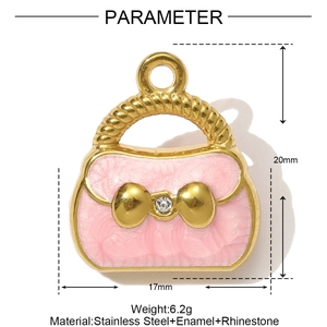 Detail eines rosa Emaille-Handtaschenanhängers mit goldener Schleife und Strassstein