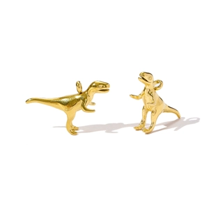 Detailed view of 3D Tyrannosaurus Rex pendants in polished gold-plated stainless steel