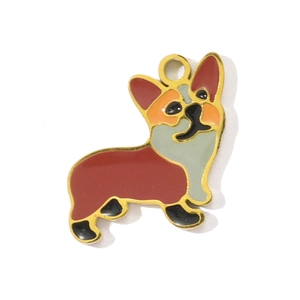 Detail of a Corgi shaped gold-toned enamel pendant with rich brown and gray details