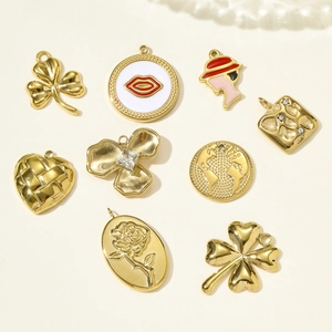 Set of nine gold-plated stainless steel charms with clover, heart, and enamel floral designs