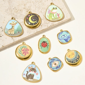 French vintage enamel animal pendants with giraffe and cat motifs for DIY jewelry
