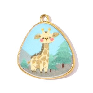 Detailed view of a gold triangular pendant featuring a cute cartoon giraffe in a pine forest