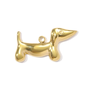 Detailed close-up of a polished gold dachshund pendant with a shiny mirror finish