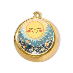 Macro detail of round golden pendant featuring a smiling sun and tiny flowers
