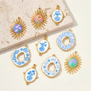 Vintage sunflower porcelain pendant in stainless steel with blue floral patterns