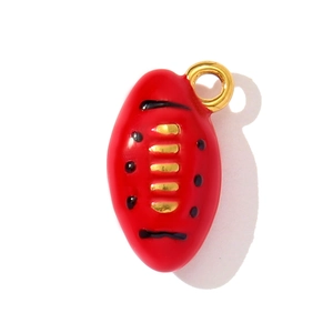 Detail of red enamel 3D rugby charm with gold stripes and polished finish for DIY jewelry