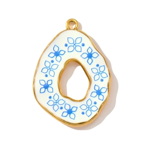 Detail of vintage blue flower enamel pendant with gold hollow frame for jewelry making