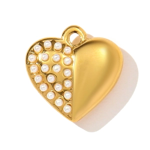 Detailed view of a golden heart pendant with elegant white pearls and a matte finish