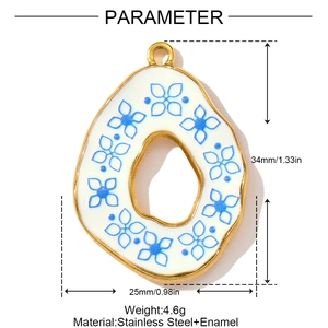 Detailed view of teardrop enamel pendant with blue floral pattern and size dimensions