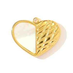 Detail of heart pendant with gold quilted texture and white mother of pearl inlay