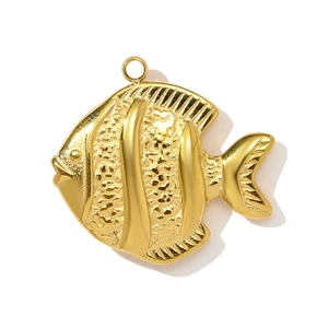 Detail of golden fish pendant featuring textured sandblasting and polished stripes