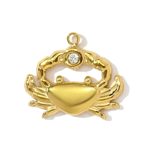 Detailed view of a gold crab pendant featuring a sparkling white zircon stone inlay