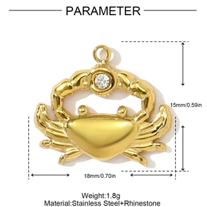 Detail view of a 18x15mm golden crab pendant in stainless steel with a clear rhinestone