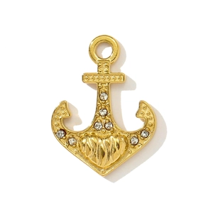 Detailed view of a gold anchor pendant with heart design and crystal rhinestones