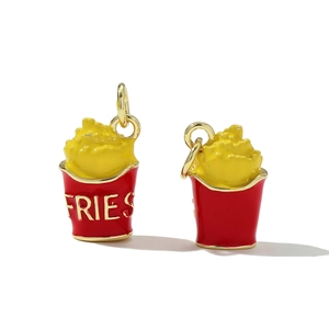 Detail of French fries charm with red and yellow enamel finish and golden metal ring