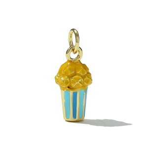 Macro detail of a 3D popcorn charm with gold ring and blue striped bucket pattern