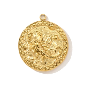 Macro view of gold Scorpio zodiac coin pendant with detailed embossed scorpion motif