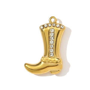 Macro view of gold 3D boot pendant with sparkling rhinestones and polished finish