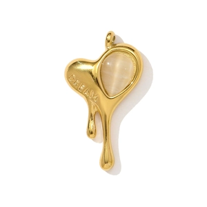 Lava-textured heart pendant with DREAM engraving and a cat-eye stone detail