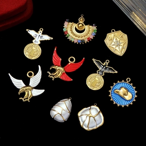 Various bohemian eagle and cowboy hat pendants with colorful enamel and gold plating