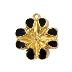 Detailed view of a gold and black enamel flower pendant with an eight-petal floral design