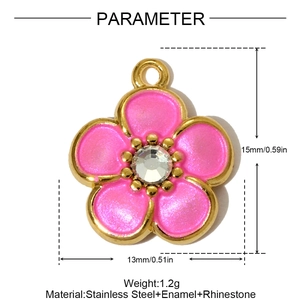 Detail view of pink enamel flower pendant with gold trim and crystal center
