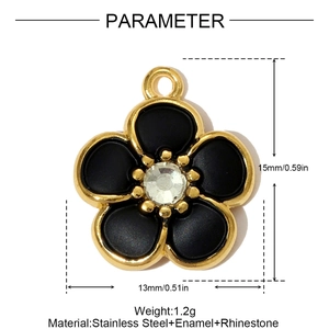 Detail view of flower pendant with black enamel petals and crystal center on white base