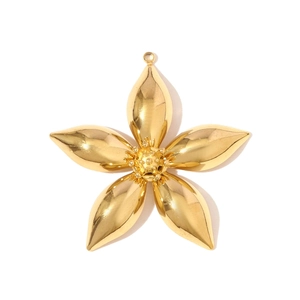 Detailed close-up of a polished gold-finish five-petal flower pendant with a top ring