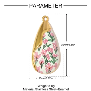 Macro view of teardrop pendant with pink flower enamel showing 36mm by 16mm size
