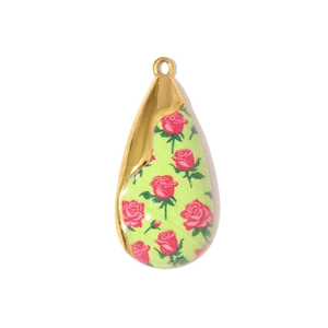 Macro shot of water-drop stainless steel pendant with pink rose motif on green inlay
