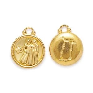 Double-sided Gemini zodiac pendant with embossed figures and star map in gold finish
