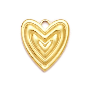 Macro shot of gold heart-shaped pendant featuring multi-layered 3D metal structure and hook