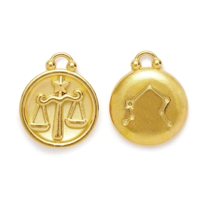 Golden Libra zodiac pendant featuring embossed scales and constellation chart details
