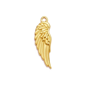 Detailed view of a golden wing pendant with fine feather texture and hanging loop
