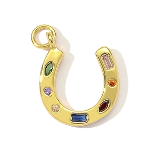 Macro detail of horseshoe necklace pendant with vibrant multi-colored zircon stones