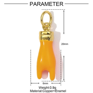 Detail view of 20mm orange enamel and gold copper tusk pendant with size parameters