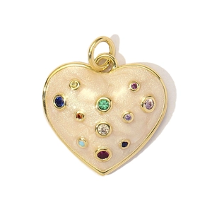 Detail of a gold heart pendant with beige enamel and multi-color crystal inlays