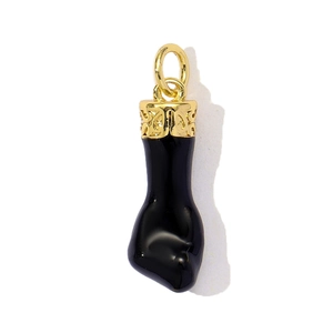 Detailed close-up of a cowboy hat pendant with gold hollowed metal and black drip oil finish