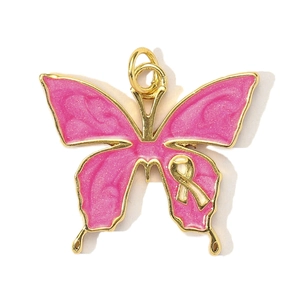 Close-up of a pink enamel butterfly charm with gold edges and a yellow ribbon accent