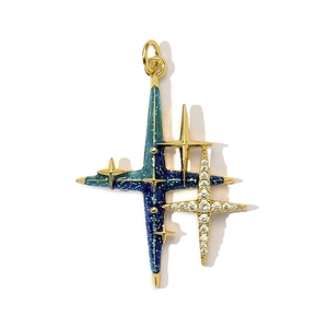 Close-up of vintage multi-layered gold star pendant with blue enamel and zircons