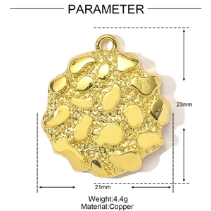 Detail view of gold-plated copper pendant with hammered texture and 21mm dimensions