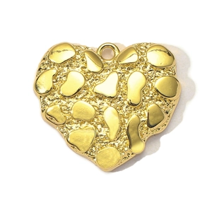 Close-up of heart-shaped gold pendant with textured pebble finish and polished accents