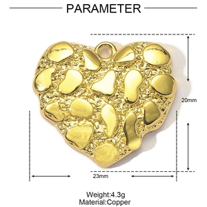 Detail of gold heart pendant with textured finish, showing 20mm by 23mm dimensions