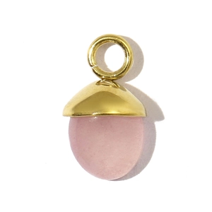 Detailed view of pink gemstone pendant with gold stainless steel pinecone cap and ring